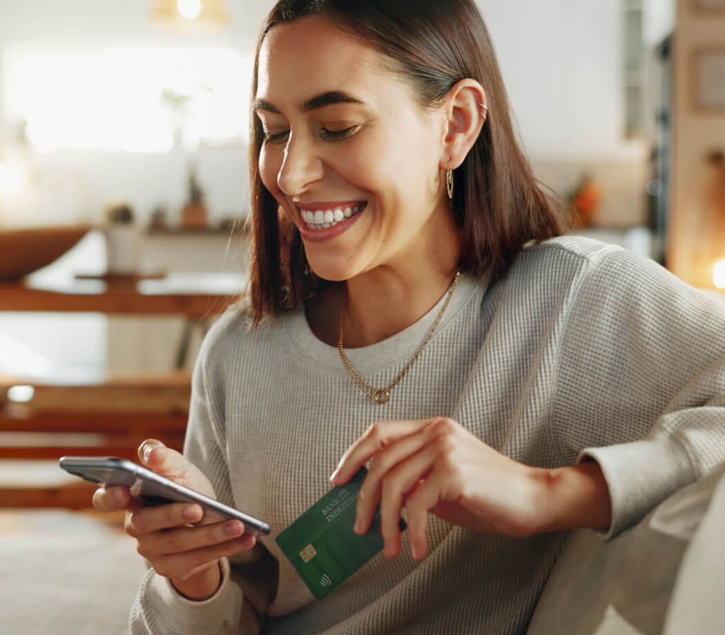 Woman holding debit card
